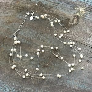 Delicate pearl necklace.